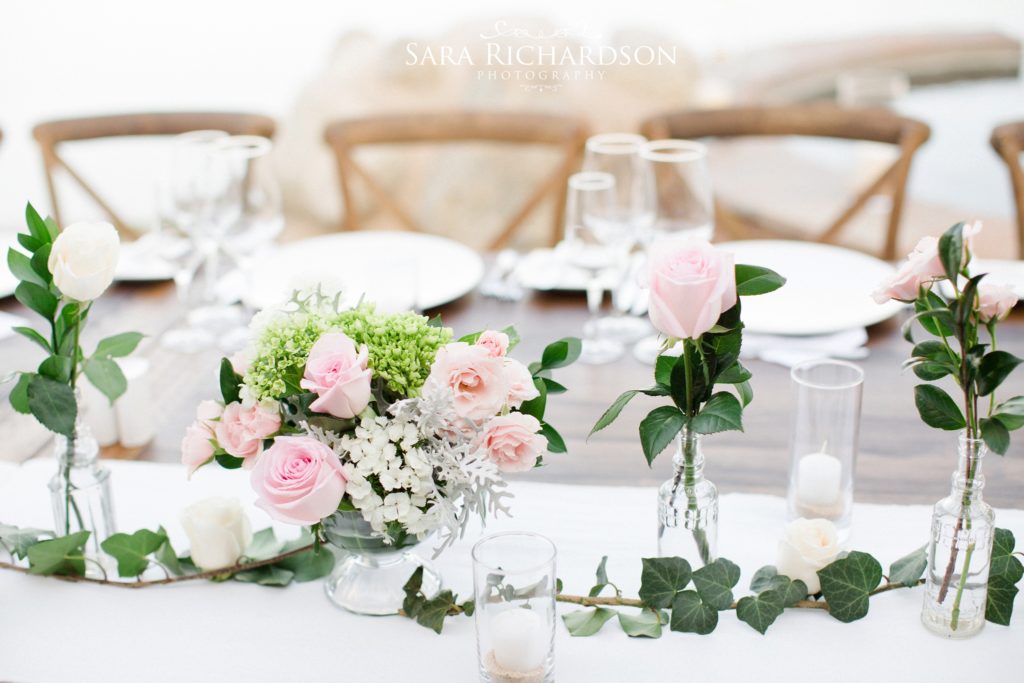 romantic beach wedding used delicate shades of pink roses for tables