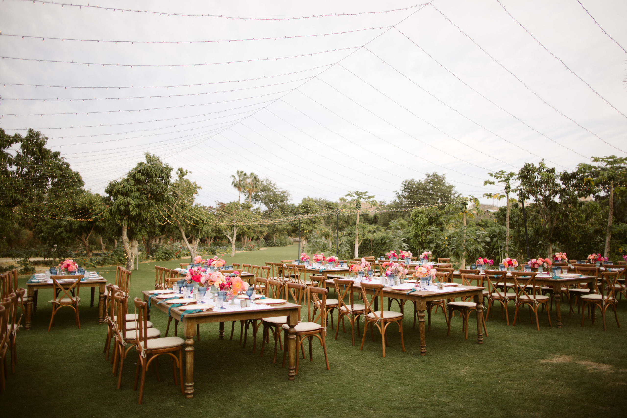 a colorful array of floral table design at Mexican themed wedding