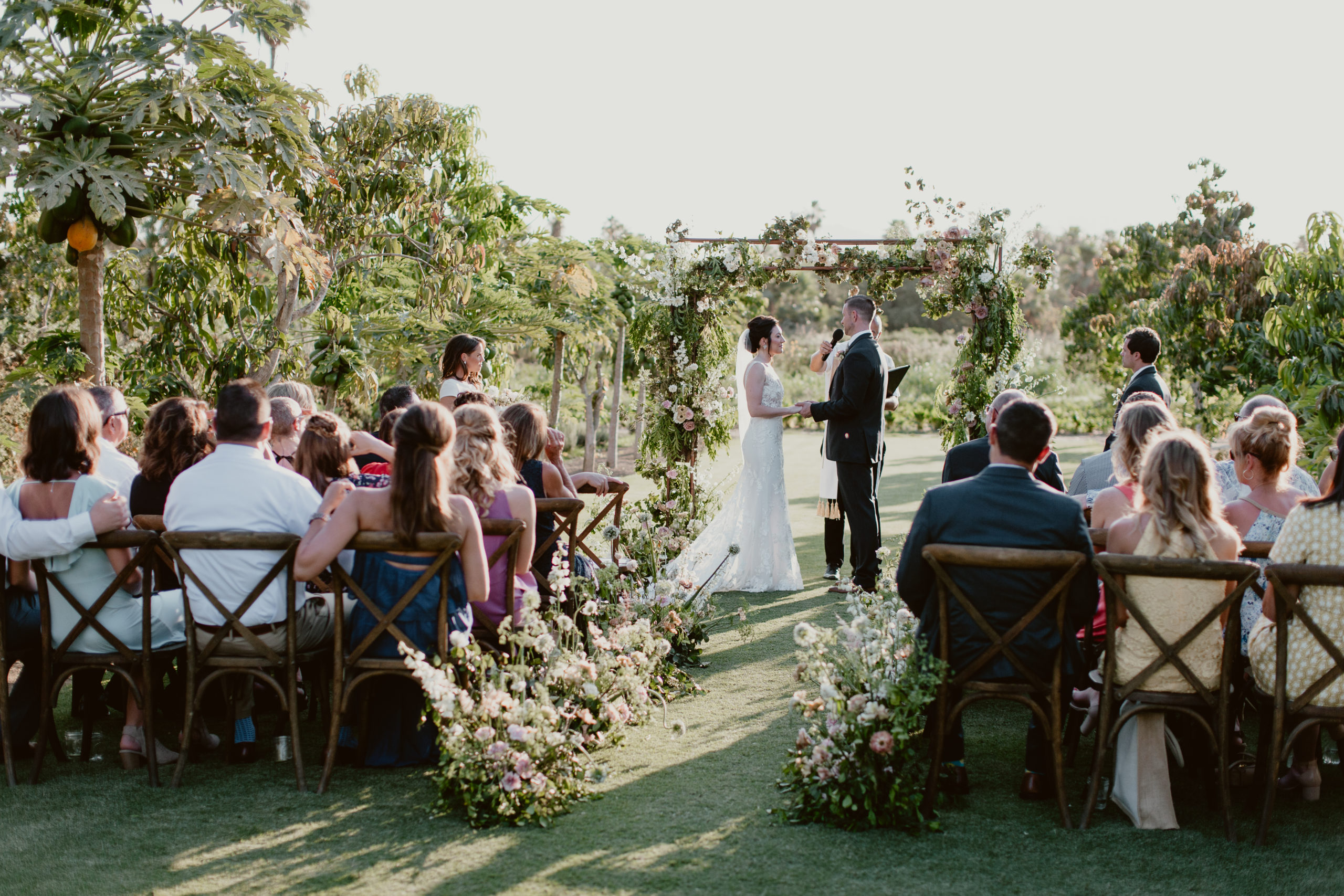 saying vows at June wedding at Flora Farms